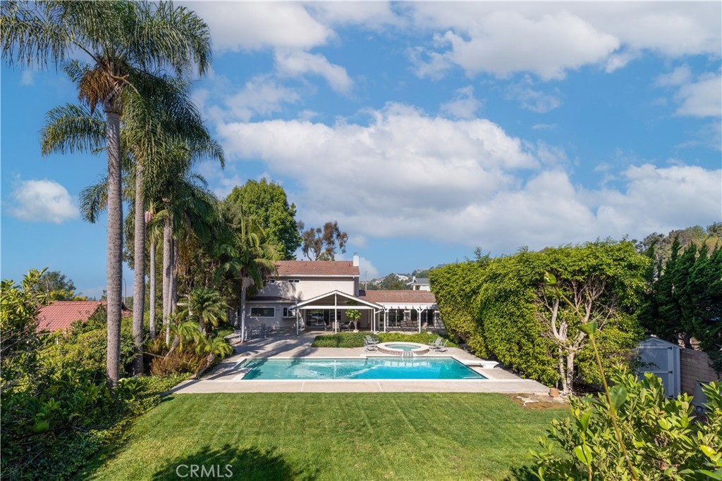 8224 Seranata Drive Whittier, CA 90605 - Photo 48 of 55 a view of a swimming pool with a yard