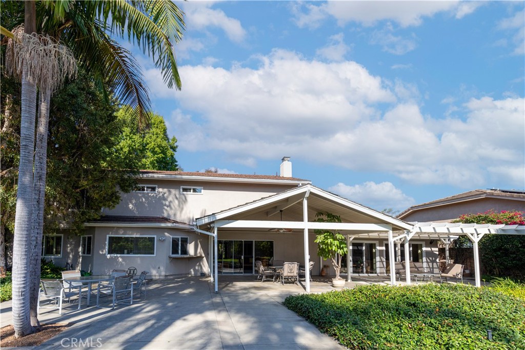 8224 Seranata Drive Whittier, CA 90605 - Photo 51 of 55 a view of a white house with a big yard and potted plants