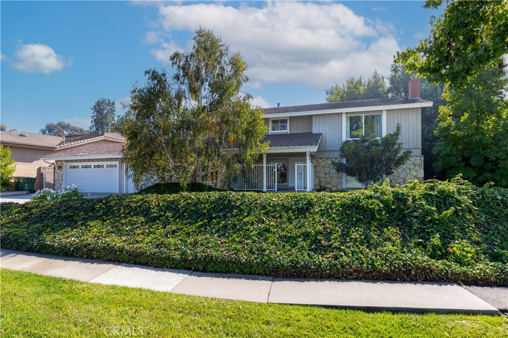 8224 Seranata Drive Whittier, CA 90605 - Photo 55 of 55 a front view of a house with a garden