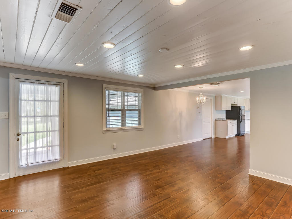 75195 Edwards Road Yulee, FL 32097 - Photo 8 of 49 a view of an empty room with wooden floor and a window