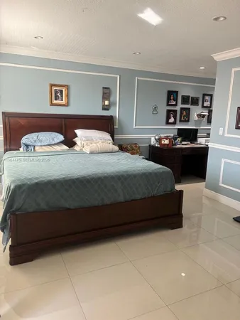 a bedroom with a bed and couch