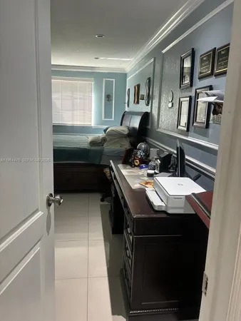 a view of walk in closet with clothes