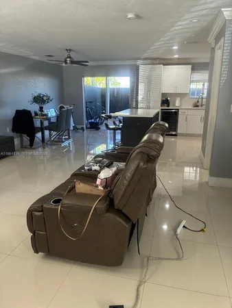 a room with lots of furniture and a chandelier