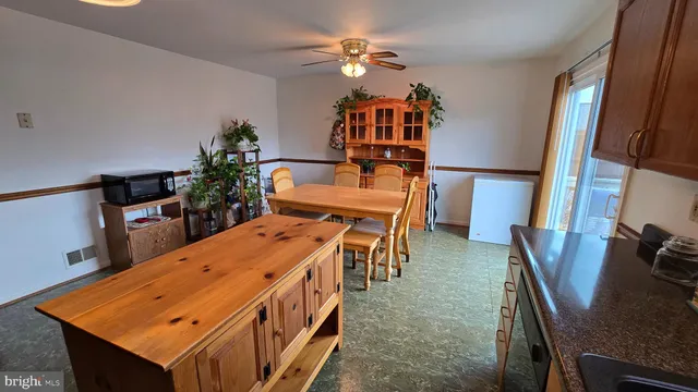 a dining room with furniture and window