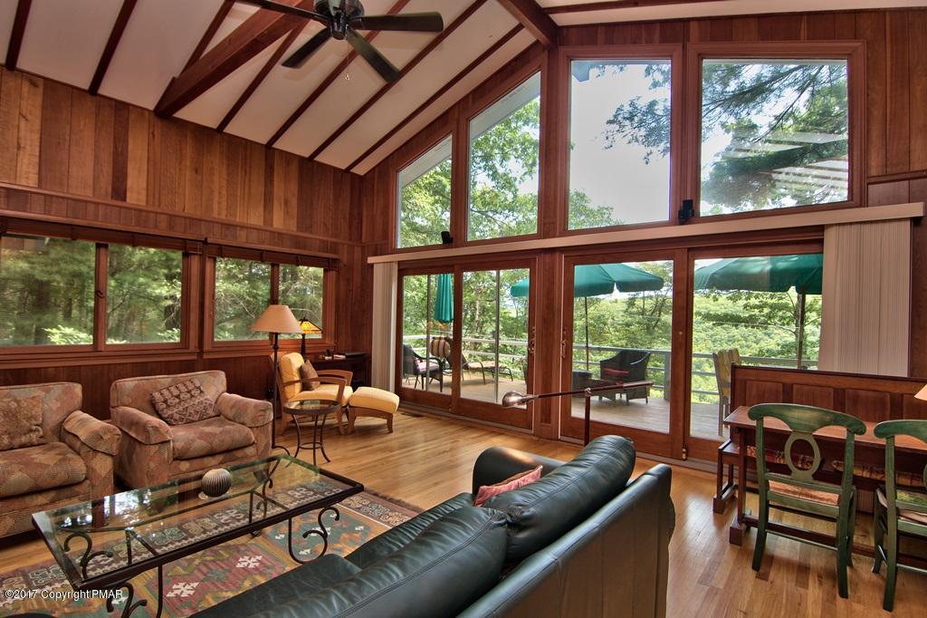 342 Summit Road Swiftwater, PA 18370 - Photo 15 of 53 a living room with furniture and floor to ceiling windows