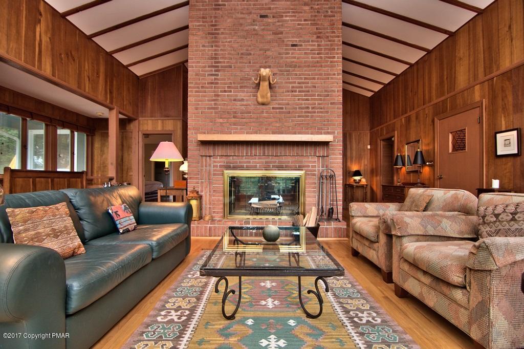 342 Summit Road Swiftwater, PA 18370 - Photo 19 of 53 a living room with furniture and a fireplace