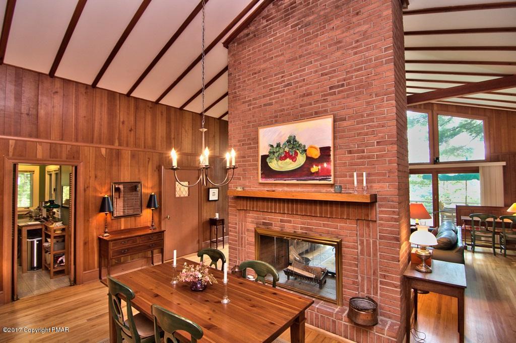 342 Summit Road Swiftwater, PA 18370 - Photo 22 of 53 a living room with furniture a fireplace and wooden floor