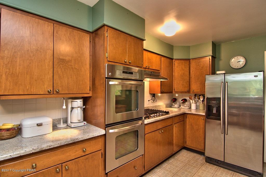 342 Summit Road Swiftwater, PA 18370 - Photo 25 of 53 a kitchen with a refrigerator and a sink