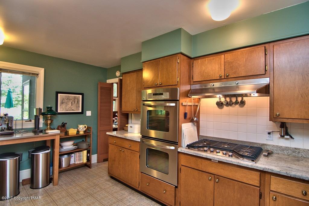 342 Summit Road Swiftwater, PA 18370 - Photo 27 of 53 a kitchen with a stove and a sink