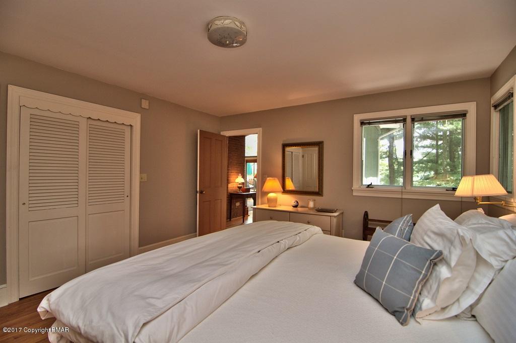 342 Summit Road Swiftwater, PA 18370 - Photo 30 of 53 a bedroom with a large bed and a window