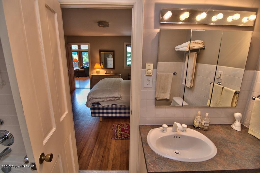 342 Summit Road Swiftwater, PA 18370 - Photo 31 of 53 a en suite bathroom with sink and mirror