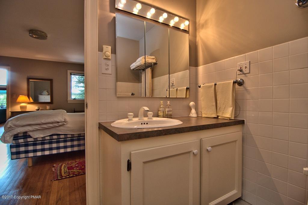 342 Summit Road Swiftwater, PA 18370 - Photo 32 of 53 a en suite bathroom with a sink and a mirror