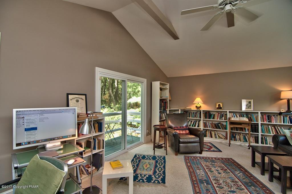342 Summit Road Swiftwater, PA 18370 - Photo 43 of 53 a living room with furniture and a book shelf