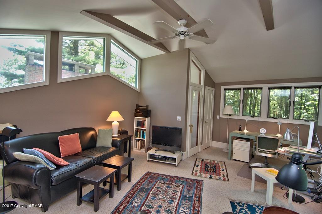 342 Summit Road Swiftwater, PA 18370 - Photo 45 of 53 a living room with furniture and a window