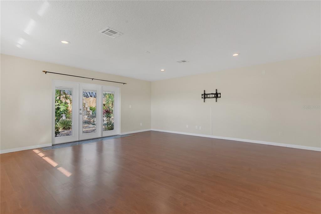 4807 Booth Road Plant City, FL 33565 - Photo 28 of 90 The primary bedroom with such a pretty tropical view