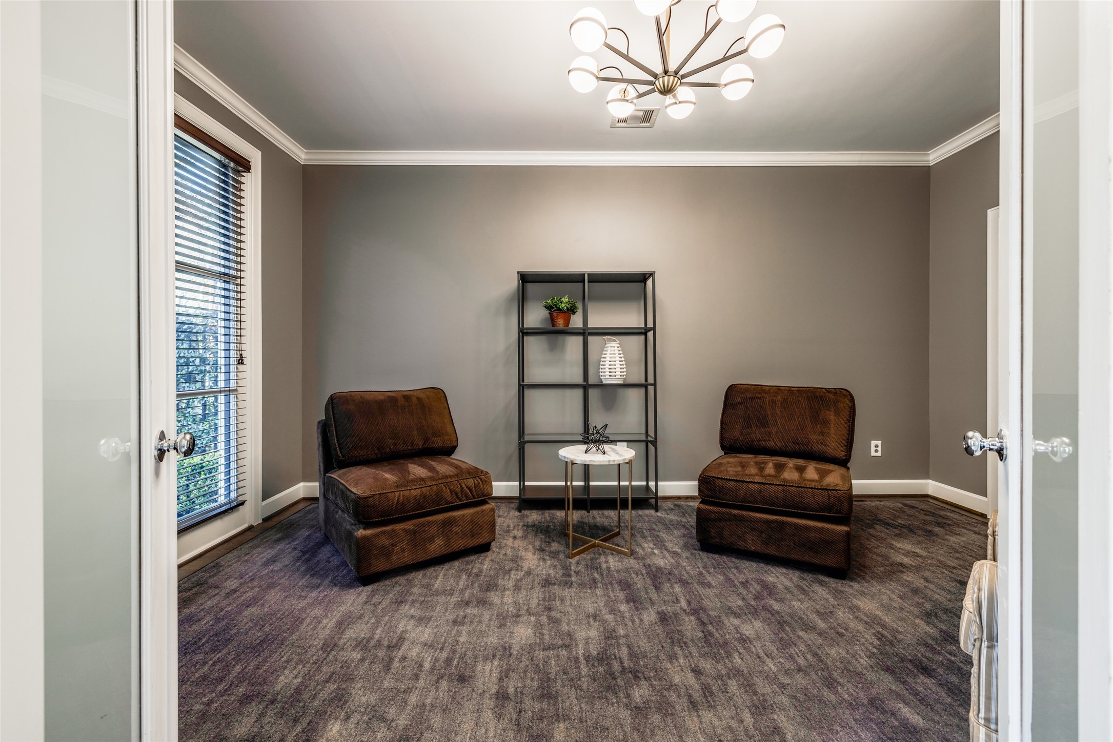 604 Knox Street Houston, TX 77007 - Photo 5 of 42 This cozy room features soft gray walls, a modern light fixture.This flex space can be used for guests, office, or workouts