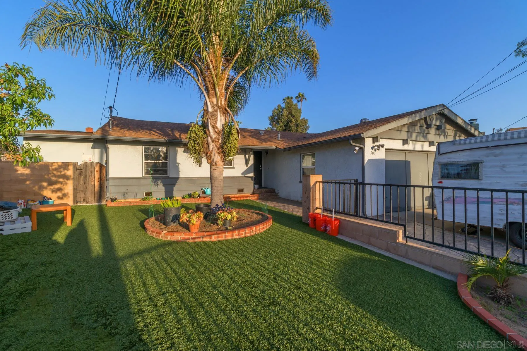 501 Thayer Drive Spring Valley, CA 91977 - Photo 15 of 20 a front view of a house with a yard table and chairs