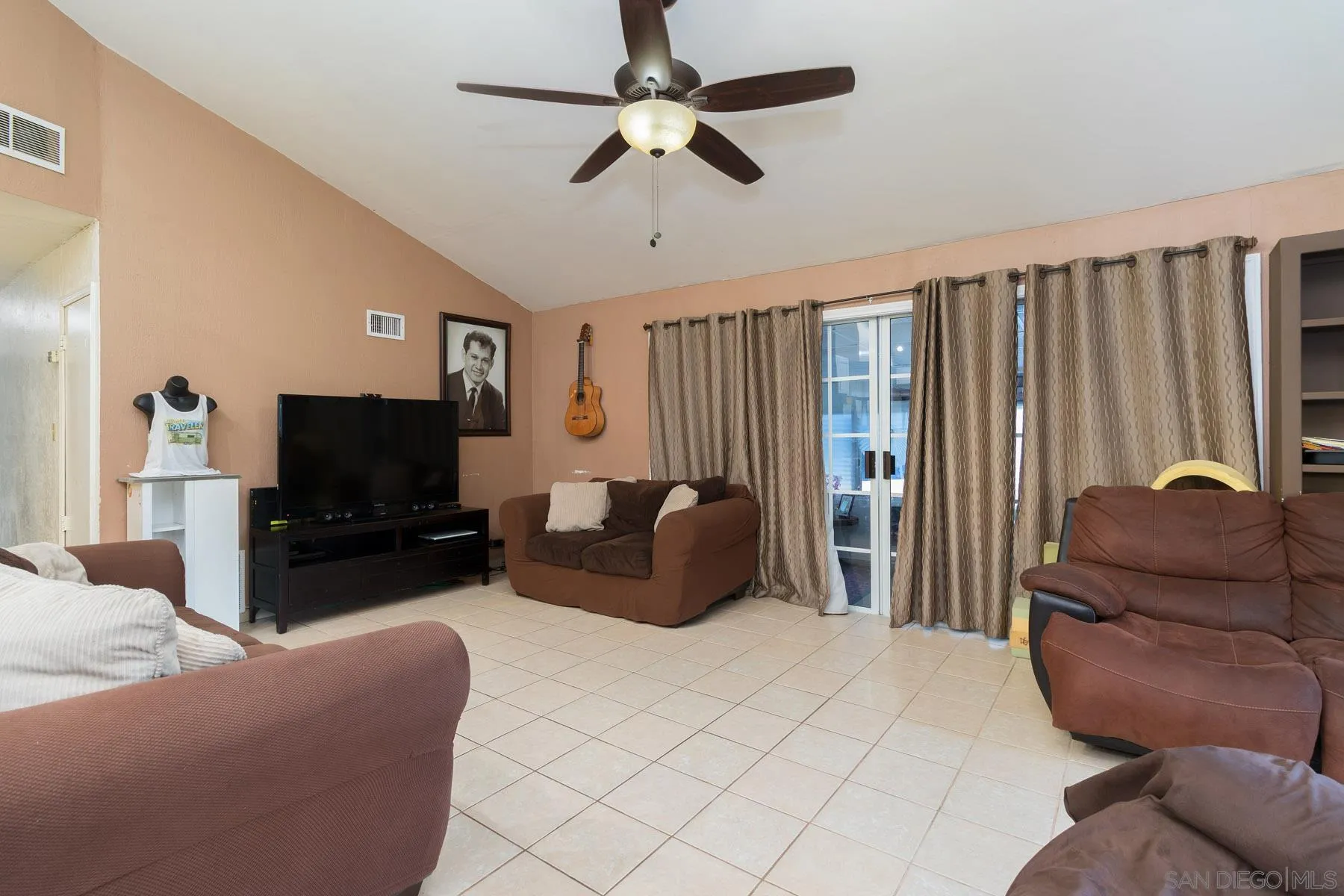 501 Thayer Drive Spring Valley, CA 91977 - Photo 6 of 20 a living room with furniture and a flat screen tv