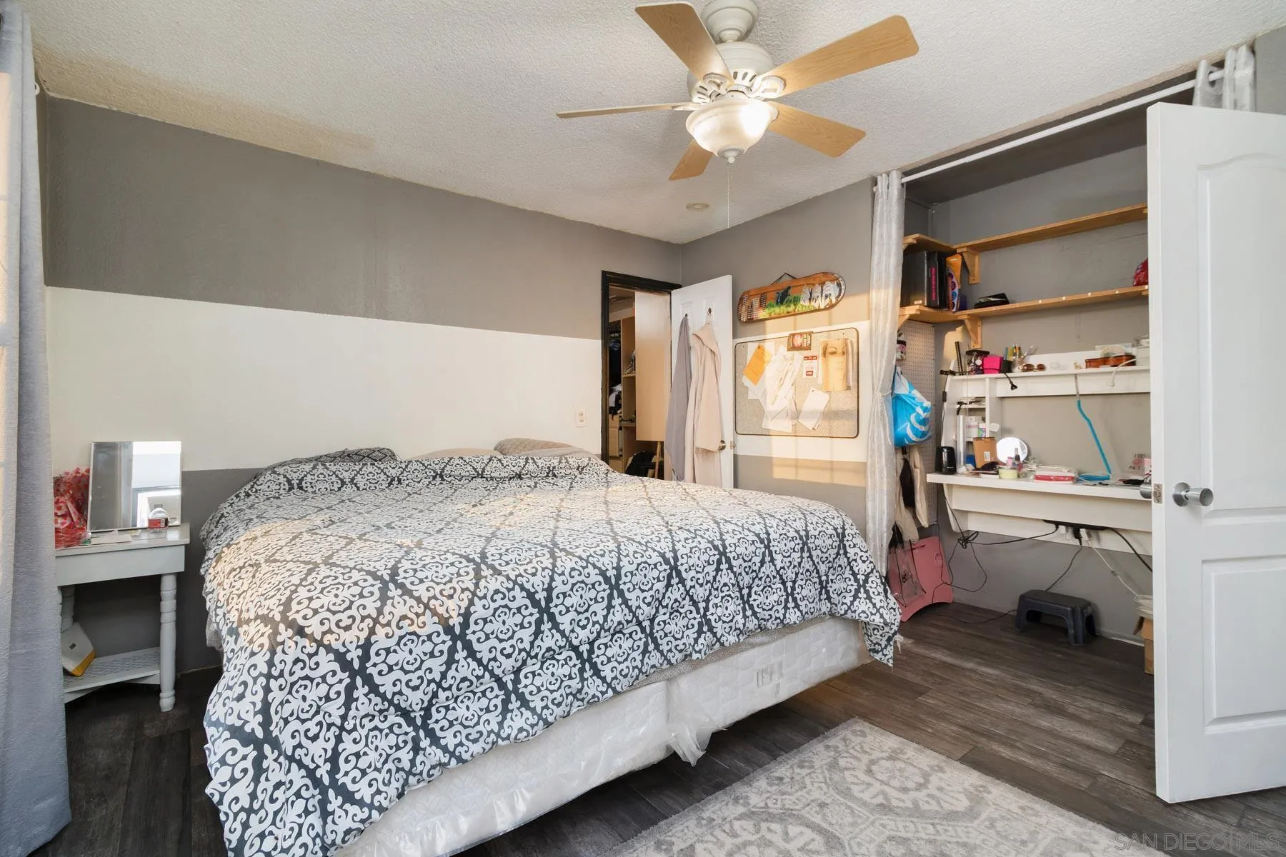 501 Thayer Drive Spring Valley, CA 91977 - Photo 9 of 20 a bedroom with a bed and a chandelier