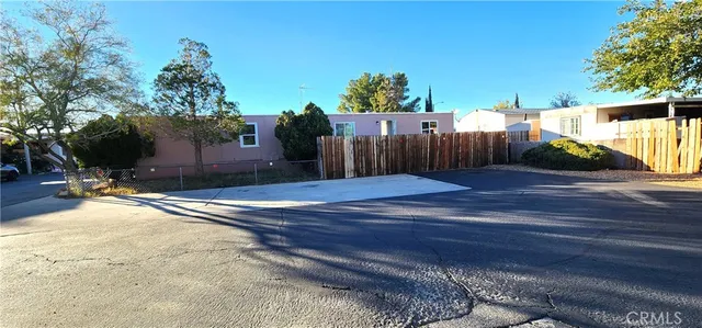 a view of a backyard of the house