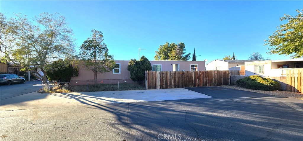 8562 C Avenue, Unit 48 Hesperia, CA 92345 - Photo 3 of 37 a view of backyard with wooden fence
