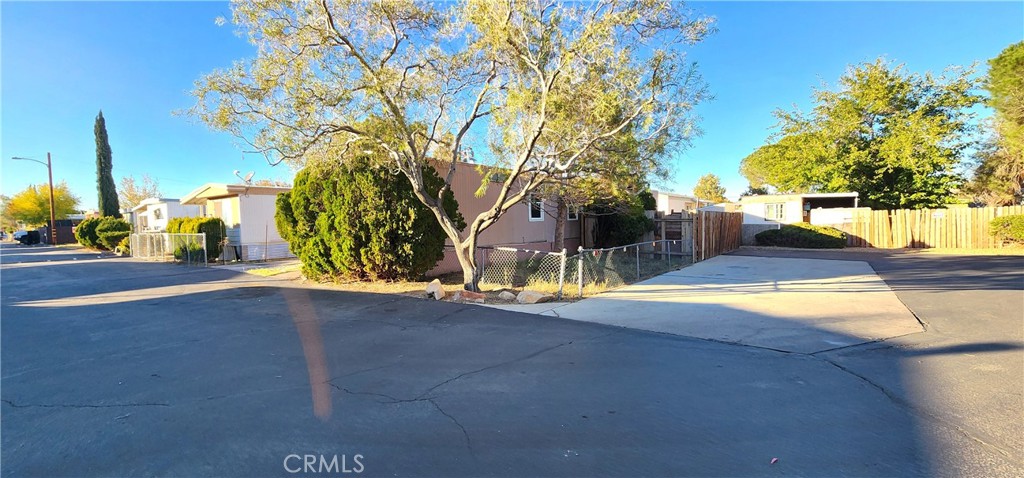 8562 C Avenue, Unit 48 Hesperia, CA 92345 - Photo 5 of 37 a view of yard along with trees