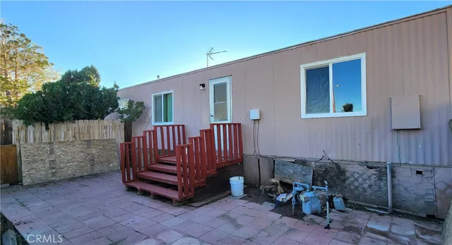 a view of a deck with chair and table