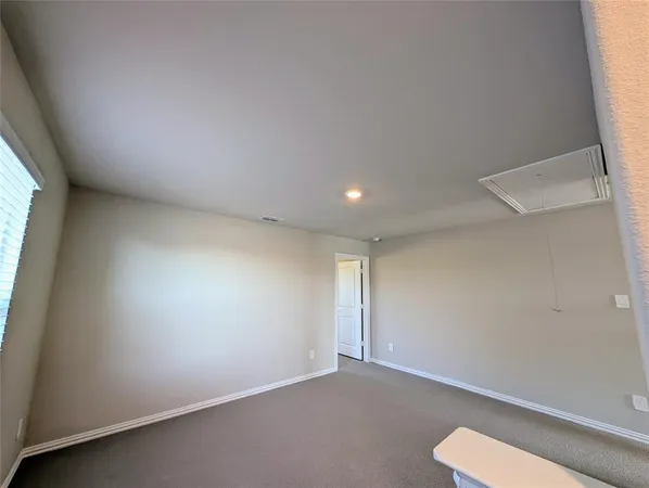 an empty room with a bench