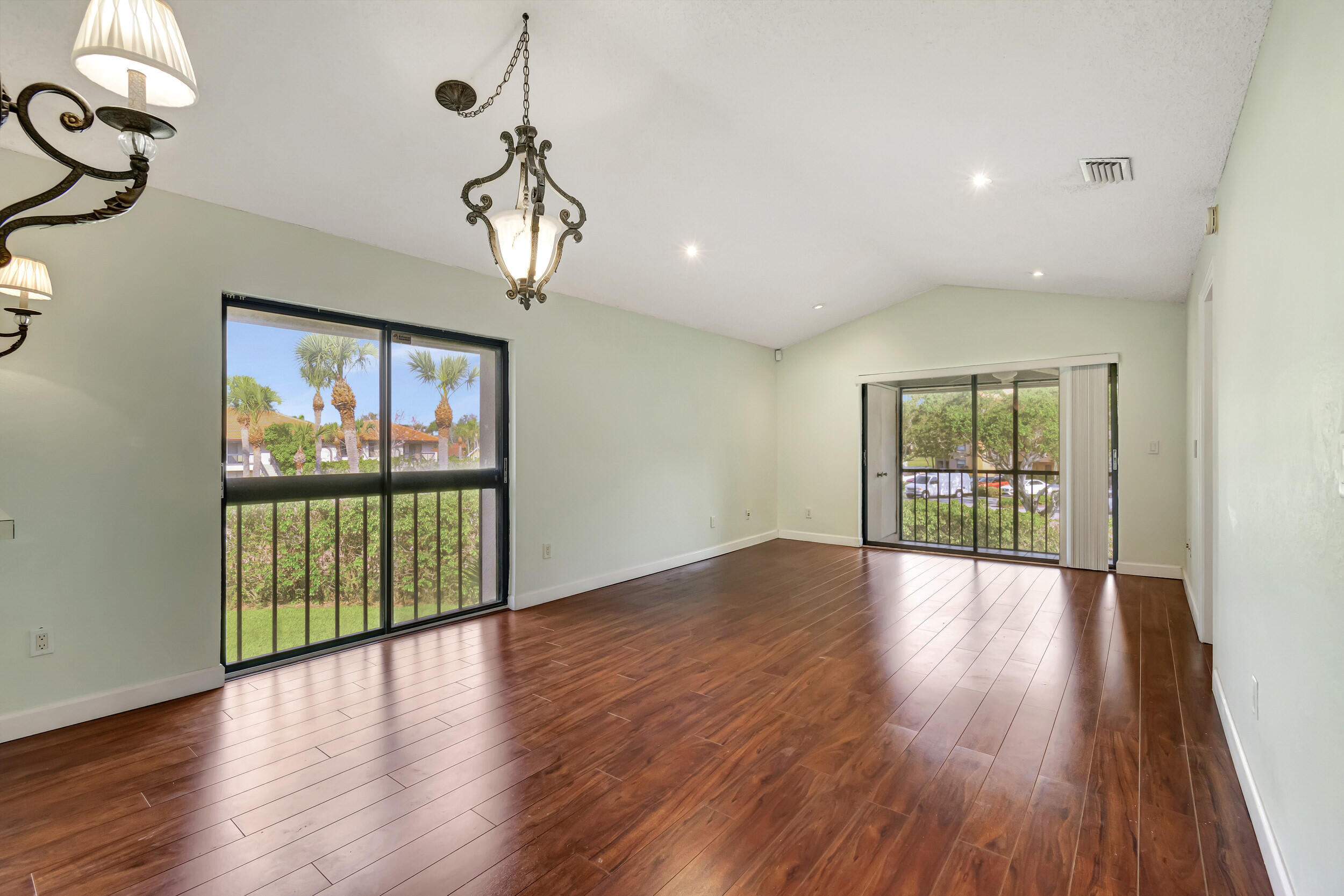 351 Club Circle, Unit 207 Boca Raton, FL 33487 - Photo 1 of 28 a view of an entryway with wooden floor