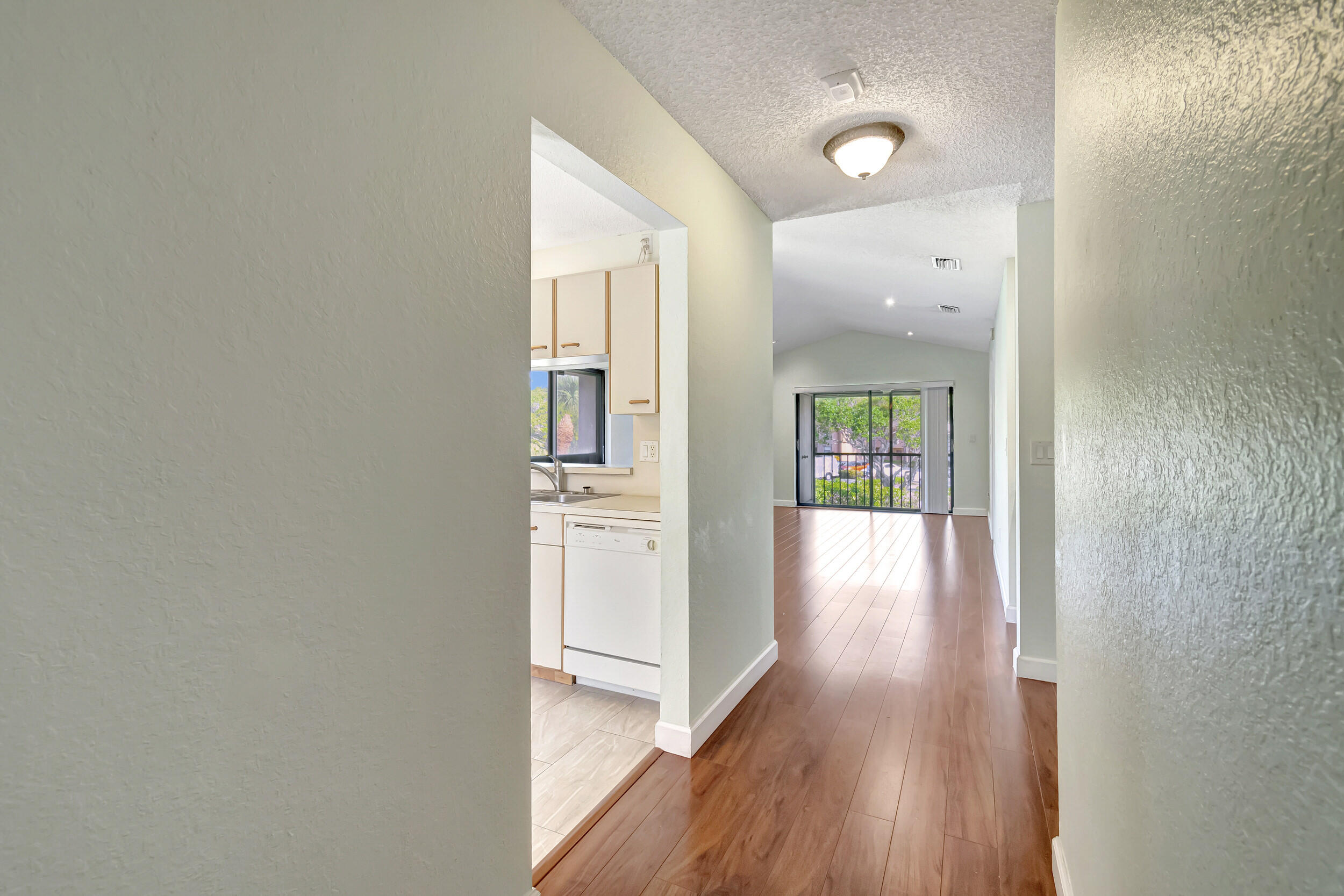 351 Club Circle, Unit 207 Boca Raton, FL 33487 - Photo 3 of 28 a view of hallway with wooden floor