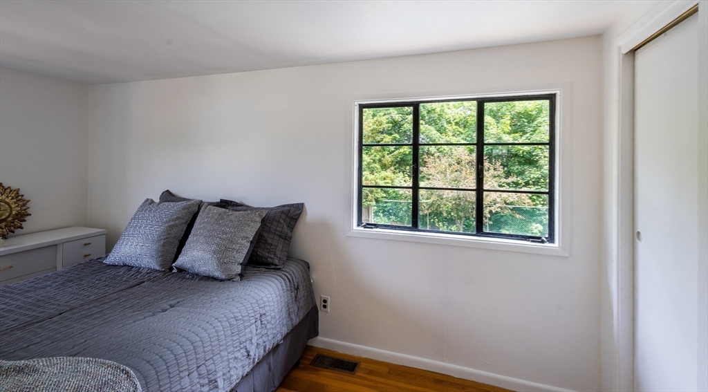 30 Leighton Road Boston, MA 02136 - Photo 13 of 38 a bedroom with a bed and a window