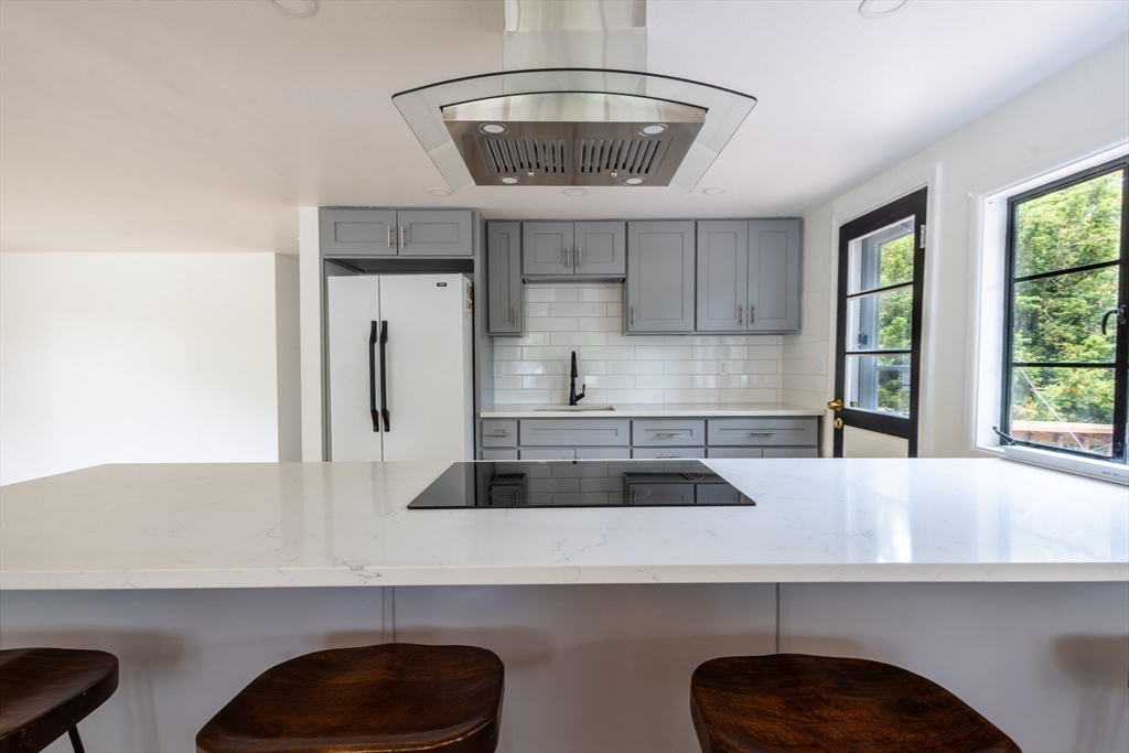 30 Leighton Road Boston, MA 02136 - Photo 14 of 38 a kitchen with a sink a window and cabinets
