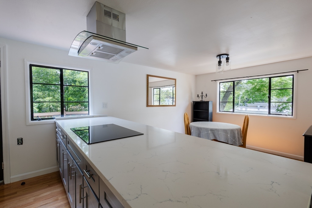 30 Leighton Road Boston, MA 02136 - Photo 17 of 38 a kitchen with a stove a sink and a window