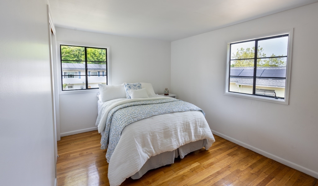 30 Leighton Road Boston, MA 02136 - Photo 31 of 38 a bed sitting in a bedroom next to a window