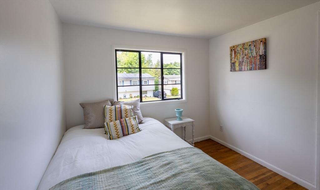 30 Leighton Road Boston, MA 02136 - Photo 34 of 38 a bedroom with a bed and a window