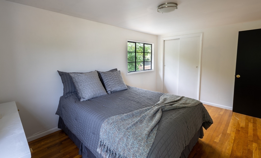 30 Leighton Road Boston, MA 02136 - Photo 35 of 38 a bedroom with a bed and a window