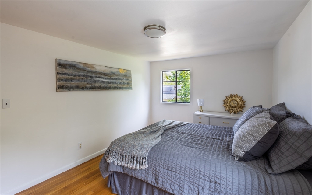 30 Leighton Road Boston, MA 02136 - Photo 37 of 38 a bedroom with a bed and a window
