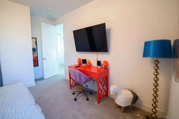 a room with furniture and a flat screen tv
