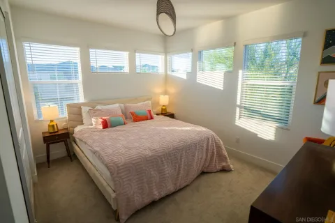 a bedroom with a bed and window