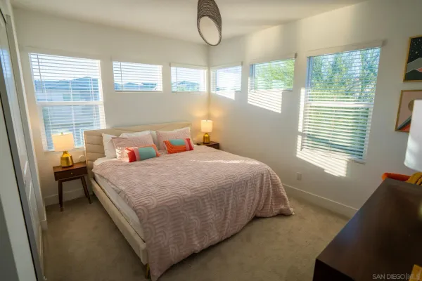 a bedroom with a bed and window