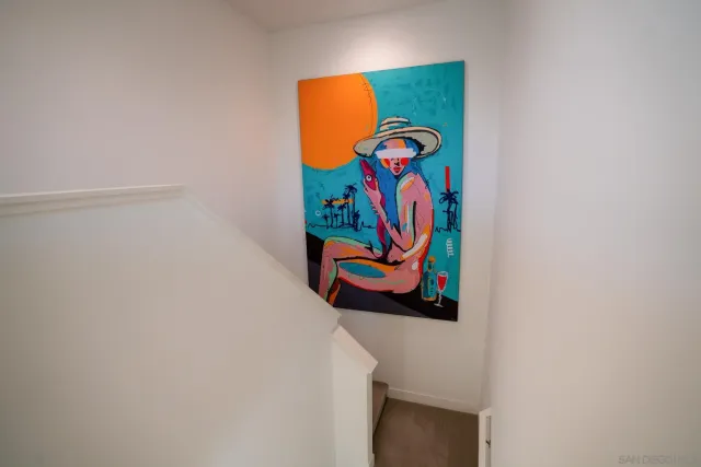 a bedroom with a bed chair and a window