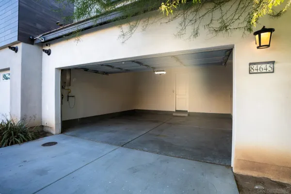 a view of empty room with window and outdoor view