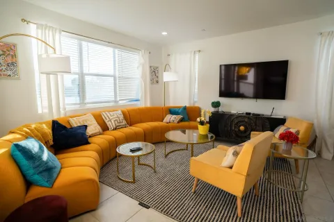 a living room with furniture fireplace and a flat screen tv