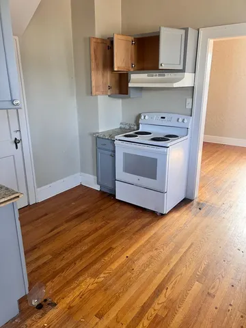 a kitchen with a stove and a refrigerator