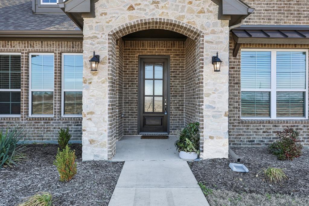 800 Majors Road Van Alstyne, TX 75495 - Photo 4 of 40 Property entrance with stone siding and brick siding