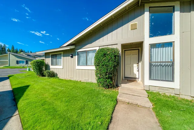 a front view of a house with a yard