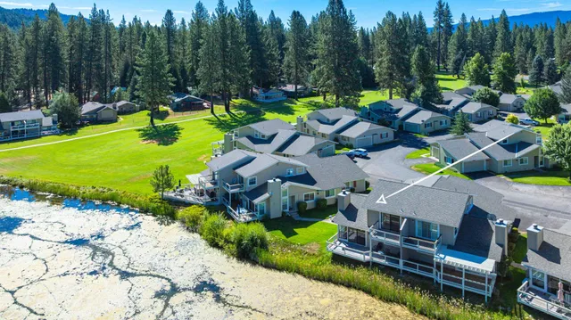 a view of yard with swimming pool and green space