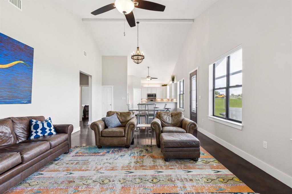 1430 Cr 2735 Decatur Tx 76234 Decatur, TX 76234 - Photo 5 of 13 Living room featuring high vaulted ceiling, ceiling fan, and dark wood-style floors
