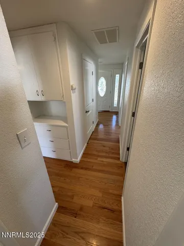 a view of a hallway view with staircase