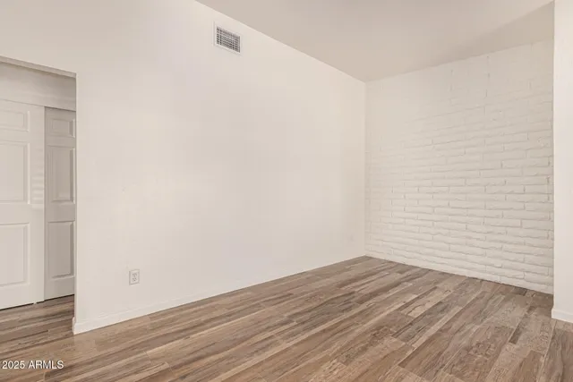 a view of small space with wooden floor